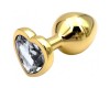 Золотая металлическая анальная пробка с прозрачным камушком в виде сердечка M
